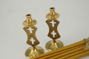 set of double cross design brass candle holders and candles